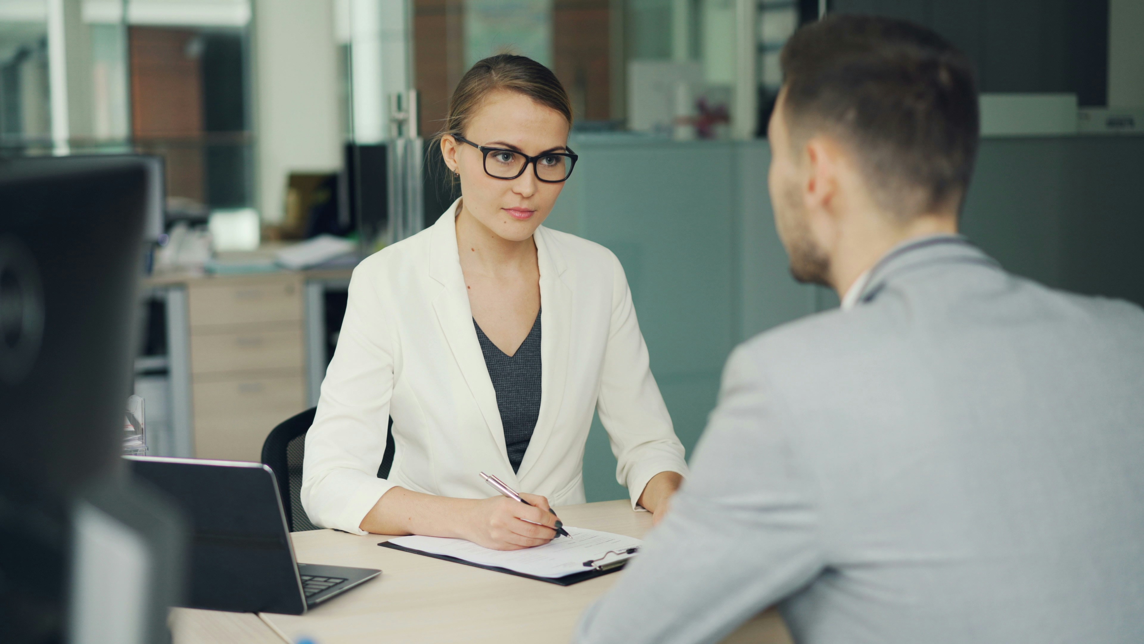 Team collaborating around table in professional meeting
